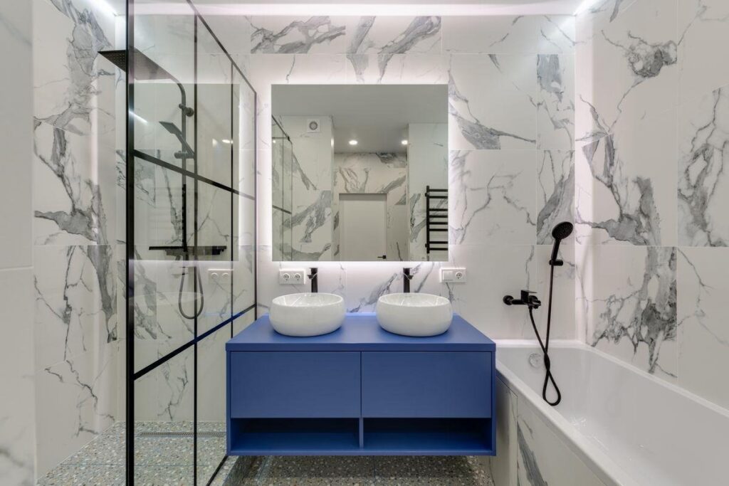 Tiled walk-in shower and bathtub in a freshly remodeled bathroom